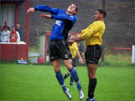 Photo: Rob Blatchford (blue shirt) heading on from a throw in